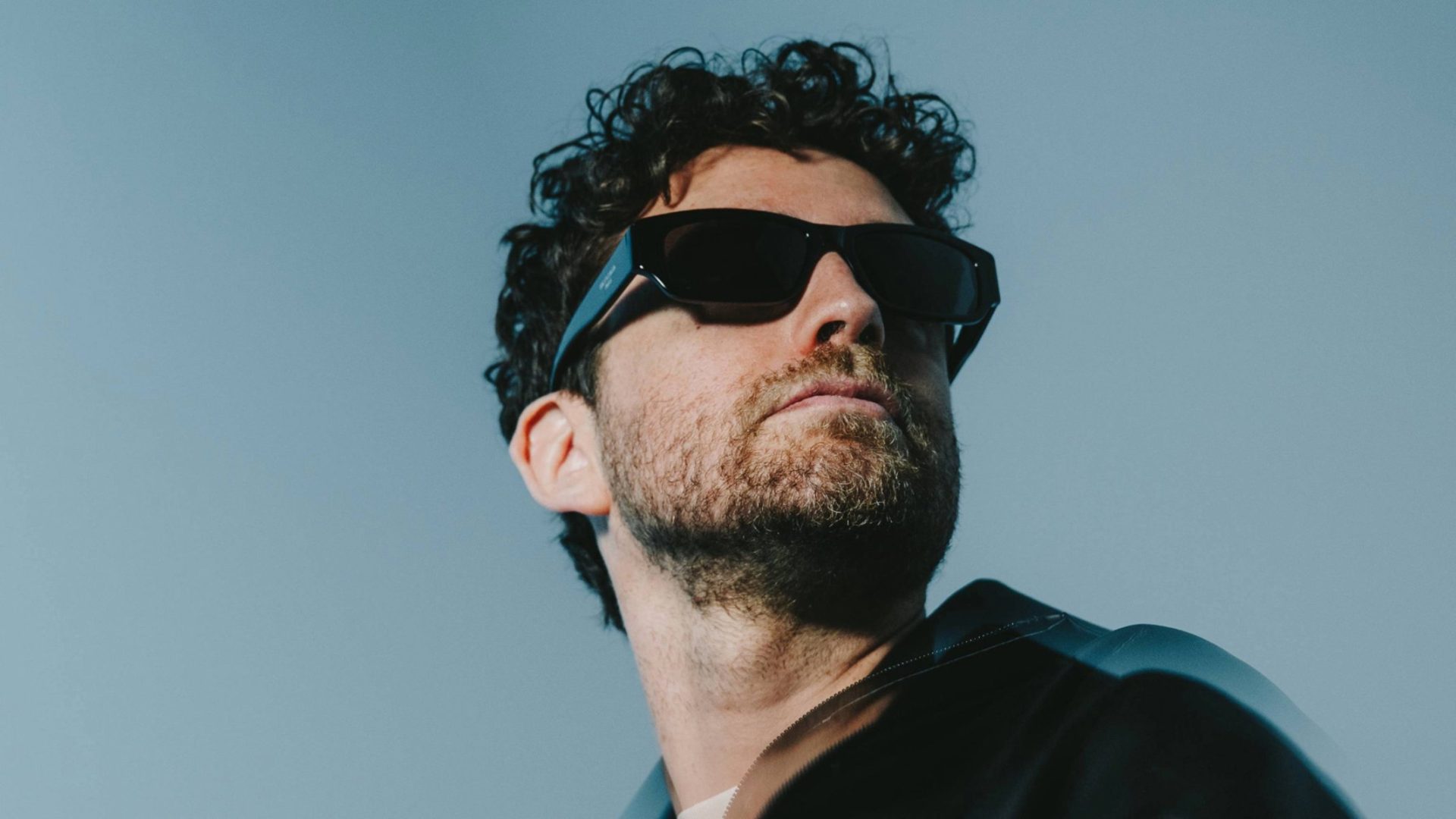Franky Rizardo in sunglasses against a blue sky
