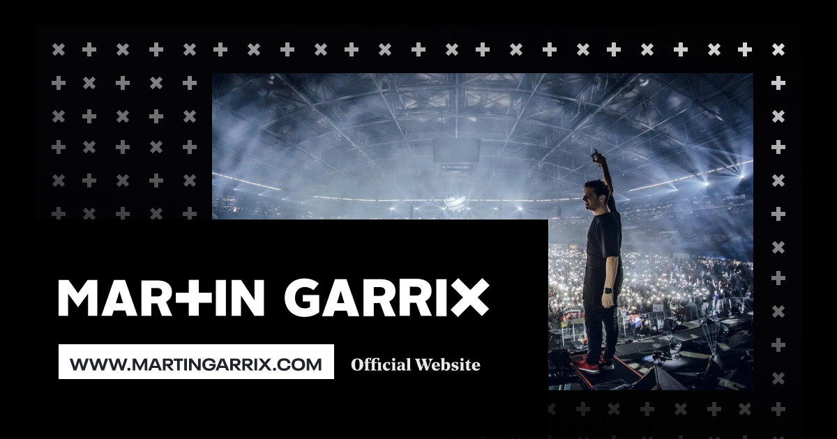 Martin Garrix on stage in front of an arena crowd