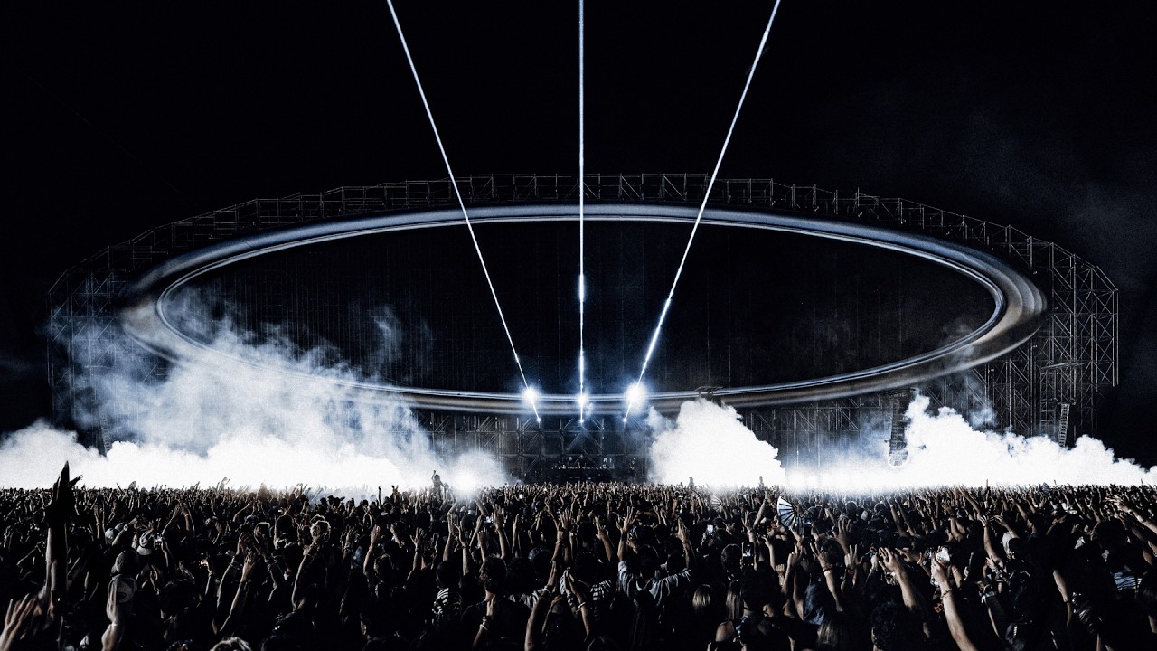 Swedish House Mafia on the ring-shaped Head Trip stage in Indio, with lasers and smoke over the crowd